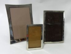 Three various size silver photo frames, largest 17cm x 12cm