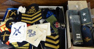 Three boxes of military cloth patches and badges including Royal Marines