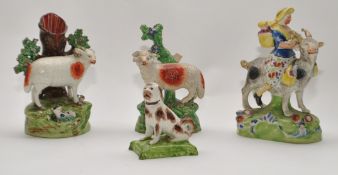 Four 19th century Staffordshire groups including Family Group on a Ram (4)