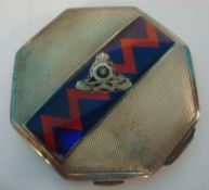 A silver and enamel compact with military crest