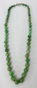 A Jade bead necklace, 43cm