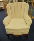 A good quality upholstered Armchair with loose cushion cabriole legs