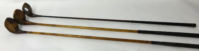 Various old golf clubs in canvas bag