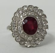 A fine 18ct ruby and diamond cluster ring, size N