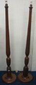 Pair of fluted mahogany standard lamps and shades (made from four poster beds)