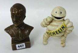 A replica small metal Michelin man figure and bust of Hitler