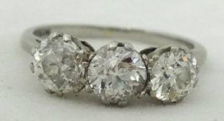 A three stone diamond ring, set in platinum approximately 1.40 ct , size L