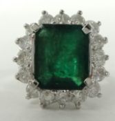 A fine emerald and diamond cluster ring, size N