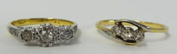 Two diamond three stone rings, (one 18ct), size M and O