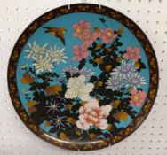 A Japanese Cloisonne plate decorated with bird and flowers, 36cm diameter