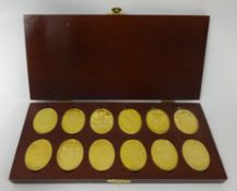The Arms of The Prince and Princess of Wales box set of gilt medallions (12)