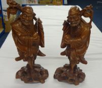 A pair of Oriental carved wood figures, (with damage), 450cm