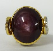 A large star ruby and diamond set ring, size O stamped 750