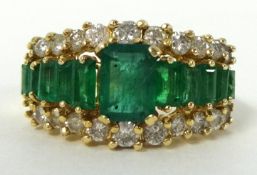 An emerald and diamond ring, stamped 14k, size R