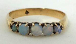 Five stone opal and gold ring, size O and two dress rings