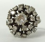 Large diamond cluster ring set with approximately 24 diamonds set in 18ct white gold, size M