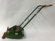 Child`s toy grass cutting machine