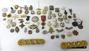 Collection of various cap badges  including SAS and gilt Naval braids