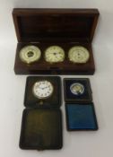 A three dial set comprising clock, hydrometer and barometer, 25cm, also two travel clocks