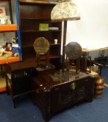 A suite of camphor wood furniture including blanket chest, bedside chest, monks seat, lamp, four