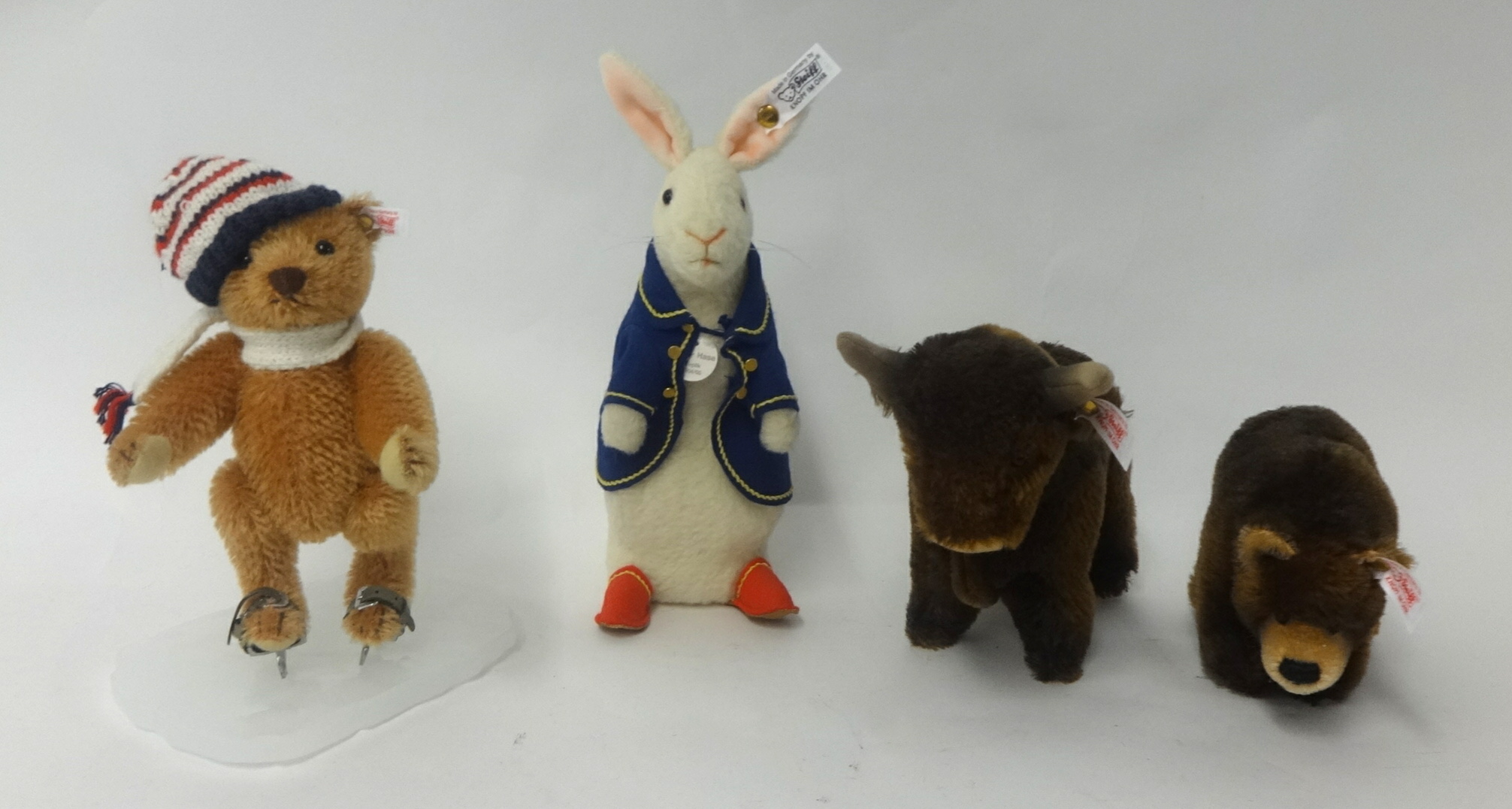 Three Steiff bears `Ice Skater, Peter Hase and `Bull and Bear`, boxed, tallest 24cm (3)