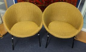 Pair Lloyd Loom gold chairs