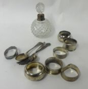Various silver items including napkin rings and scent bottle