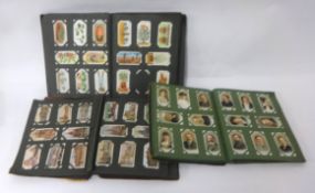 A collection of cigarette cards being the contents of a military box and three albums including