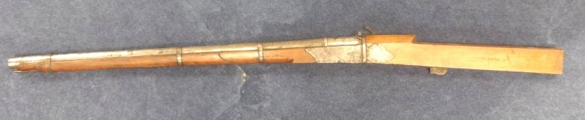 An Indian Rampart match lock gun approximately 157cm long
