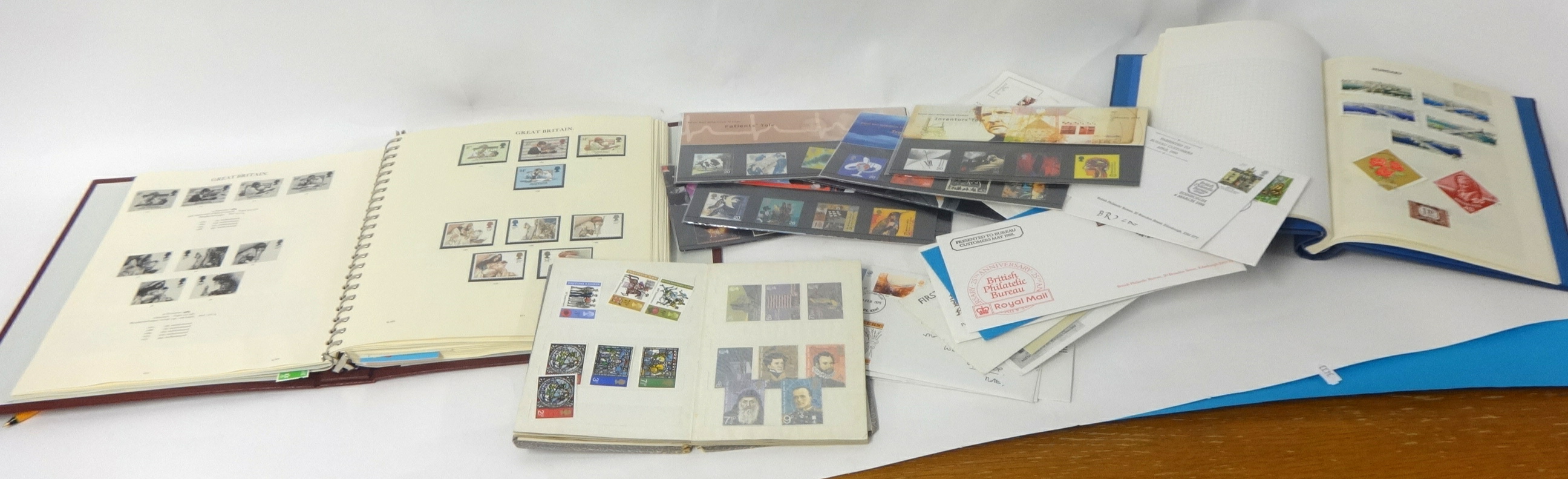 Large collection of stamps including many mint issues, six albums, approximately thirty first day