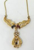 An 18ct gold ornate necklace set with ruby, diamond and sapphires on fine gold chain