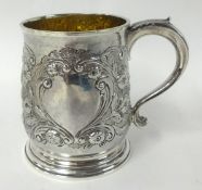An 18th century silver gilt and repose mug inscribed `1847`, 7.08 oz, London, possibly by James