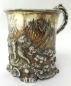 Victorian silver and repousse tankard decorated with animals in a landscape possibly by Charles