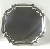 A modern silver salver on curled feet 27cm x 27cm, approximately 20 oz, circa 1962, Vinvers Ltd.