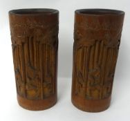 Two 20th century Chinese carved bamboo brush pots, 23cm high