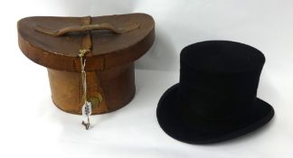 A West End style top hat and leather box