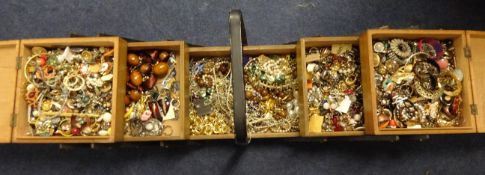 A large collection of costume jewellery in wooden sewing box