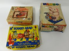 Three toys including Lumar toy gramophone, Mambo drummer and Merit `Mr Potato Head` (3)