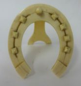 Ivory easel pocket watch stand in a form of horse shoe