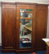 A large Victorian mahogany breakfront fitted triple door wardrobe