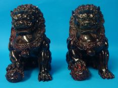 Pair of heavy stoneware models of Chinese dogs, 25cm