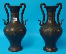 Pair of 19/20th century Chinese bronze vases with character marks to bases, 38cm high