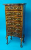 A small French style serpentine chest in walnut fitted with six drawers, 41cm x 87cm high