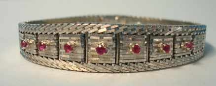 18K white metal integral bracelet set with seven small rubies overall length 180mm x 12mm tapering