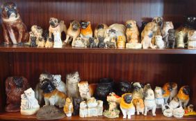 Large collection of Victorian and modern ornamental pug dogs