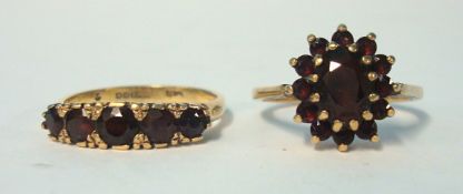 Two 9ct gold garnet dress rings