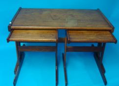 Teak nest of three tables and a magazine rack