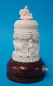 Carved ivory small table lamp decorated with cattle and figures on wood base, 14cm
