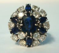 A fine sapphire and diamond cluster ring set in 18ct white gold, size O