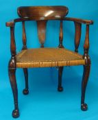 Stained wood armchair with cane seat and shaped legs
